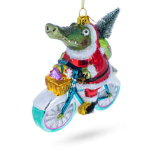 Load image into Gallery viewer, Alligator Riding Bicycle with Gifts Glass Christmas Ornament
