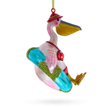 Load image into Gallery viewer, Vacationing Pelican in Swimsuit on an Inflatable Glass Christmas Ornament