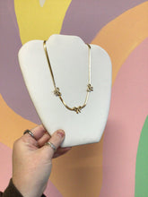 Load image into Gallery viewer, Decked in Bows Titanium Necklace
