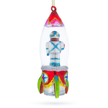 Load image into Gallery viewer, Trailblazing Astronaut Inside Spaceship Glass Christmas Ornament
