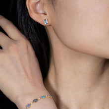 Load image into Gallery viewer, Blue Topaz Stud Earrings 14K Yellow Gold Emerald Cut