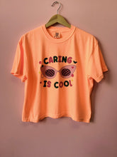 Load image into Gallery viewer, “Caring is Cool” Shirt and Crewneck