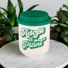 Load image into Gallery viewer, Adopt a Plant Ceramic To Go Mug | Holds 16 oz. | Eco Mug with Silicone Lid and Sleeve