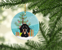 Load image into Gallery viewer, Christmas Tree and Smooth Black and Tan Dachshund Ornament - Round Ceramic Ornament – Artist-Designed Keepsake Decoration BB1587CO1