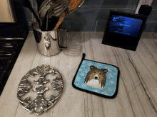 Load image into Gallery viewer, Snowflake Sheltie Pot Holders - Set of 2 - Heat-Resistant Kitchen Essentials BB1676PTHD