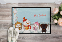 Load image into Gallery viewer, Merry Christmas Carolers Wire Haired Dachshund Chocolate Doormat - 24x36 Decorative Floor Mat – Indoor/Outdoor Rug with Artistic Flair BB2460JMAT