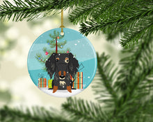 Load image into Gallery viewer, Merry Christmas Tree Wire Haired Dachshund Dapple Ornament - Round Ceramic Ornament – Artist-Designed Keepsake Decoration BB4253CO1