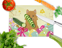 Load image into Gallery viewer, Easter Eggs Norwich Terrier Glass Cutting Boards – Durable, Decorative Kitchen Art Large BB6020LCB