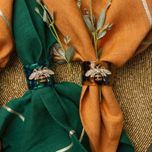 Load image into Gallery viewer, Stripey bee resin napkin rings, green tortoiseshell, set of four