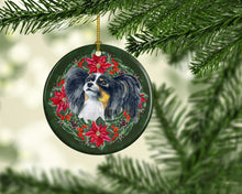 Load image into Gallery viewer, Papillon Poinsetta Wreath Ornament - Round Ceramic Ornament – Artist-Designed Keepsake Decoration