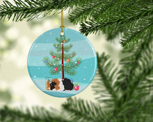 Load image into Gallery viewer, Abyssinian Guinea Pig Merry Christmas Ornament - Round Ceramic Ornament – Artist-Designed Keepsake Decoration