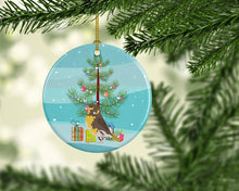 Load image into Gallery viewer, Spanish Canary Merry Christmas Ornament - Round Ceramic Ornament – Artist-Designed Keepsake Decoration