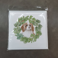 Load image into Gallery viewer, Cavalier King Charles Spaniel Blenheim Puppy Wide Eyed with Christmas Wreath Square Greeting Cards -  Blank Note Cards – 8-Pack of Artist-Designed Cards with Envelopes