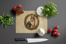 Load image into Gallery viewer, Sheltie Christmas Flowers Glass Cutting Boards – Durable, Decorative Kitchen Art
