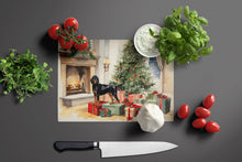 Load image into Gallery viewer, Black and Tan Coonhound Cozy Christmas Glass Cutting Boards – Durable, Decorative Kitchen Art Large