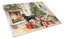 Load image into Gallery viewer, Black and Tan Coonhound Cozy Christmas Glass Cutting Boards – Durable, Decorative Kitchen Art Large