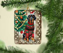 Load image into Gallery viewer, Black and Tan Coonhound Christmas Porcelain Ornament