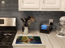 Load image into Gallery viewer, Airedale Terrier and Santa Claus Glass Cutting Boards – Durable, Decorative Kitchen Art