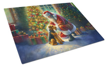 Load image into Gallery viewer, Airedale Terrier and Santa Claus Glass Cutting Boards – Durable, Decorative Kitchen Art