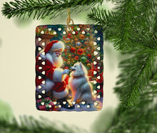 Load image into Gallery viewer, American Eskimo and Santa Claus Porcelain Ornament