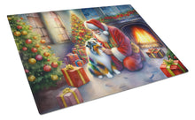 Load image into Gallery viewer, Australian Shepherd and Santa Claus Glass Cutting Boards – Durable, Decorative Kitchen Art