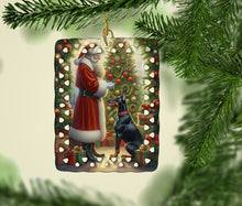 Load image into Gallery viewer, Doberman Pinscher and Santa Claus Porcelain Ornament