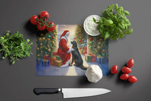 Load image into Gallery viewer, Flat-Coated Retriever and Santa Claus Glass Cutting Boards – Durable, Decorative Kitchen Art