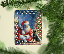 Load image into Gallery viewer, Manchester Terrier and Santa Claus Porcelain Ornament