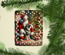 Load image into Gallery viewer, Norwegian Elkhound and Santa Claus Porcelain Ornament