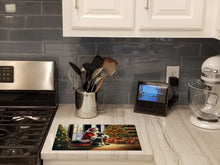 Load image into Gallery viewer, Schnauzer and Santa Claus Glass Cutting Boards – Durable, Decorative Kitchen Art