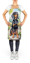 Load image into Gallery viewer, Black and Tan Coonhound Spring Path Apron – Artist-Designed Kitchen, BBQ &amp; Craft Apron