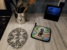 Load image into Gallery viewer, Black and Tan Coonhound Spring Path Pot Holders - Set of 2 Decorative Kitchen Helpers | Made in the USA