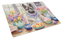 Load image into Gallery viewer, Decorating Easter Norwegian Elkhound Glass Cutting Boards – Durable, Decorative Kitchen Art