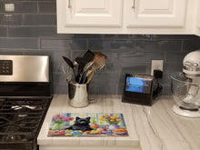 Load image into Gallery viewer, Decorating Easter Schipperke Glass Cutting Boards – Durable, Decorative Kitchen Art