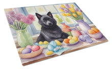 Load image into Gallery viewer, Decorating Easter Schipperke Glass Cutting Boards – Durable, Decorative Kitchen Art