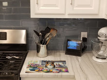 Load image into Gallery viewer, Decorating Easter Sheltie Glass Cutting Boards – Durable, Decorative Kitchen Art