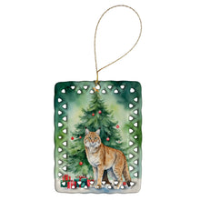 Load image into Gallery viewer, Highlander Lynx Cat By the Christmas Tree Porcelain Ornament