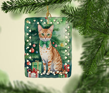 Load image into Gallery viewer, Ocicat Cat By the Christmas Tree Porcelain Ornament