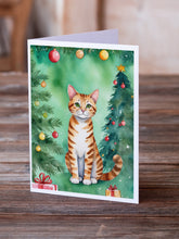 Load image into Gallery viewer, Safari Cat By the Christmas Tree Greeting Cards - Blank Note Cards – 8-Pack of Artist-Designed Cards with Envelopes