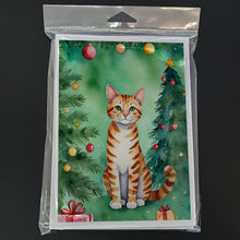 Load image into Gallery viewer, Safari Cat By the Christmas Tree Greeting Cards - Blank Note Cards – 8-Pack of Artist-Designed Cards with Envelopes
