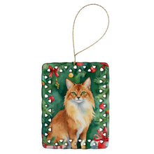 Load image into Gallery viewer, Somali Cat By the Christmas Tree Porcelain Ornament