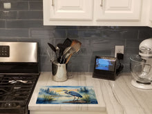 Load image into Gallery viewer, Blue Heron Emerging as the day fades Glass Cutting Boards – Durable, Decorative Kitchen Art