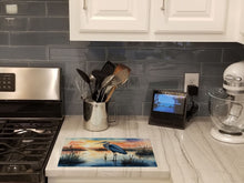 Load image into Gallery viewer, Blue Heron Setting Sun Glass Cutting Boards – Durable, Decorative Kitchen Art