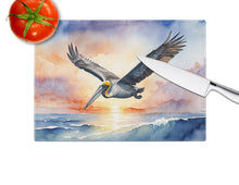 Load image into Gallery viewer, Pelican Fyling at Sunrise Glass Cutting Boards – Durable, Decorative Kitchen Art
