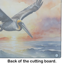 Load image into Gallery viewer, Pelican Fyling at Sunrise Glass Cutting Boards – Durable, Decorative Kitchen Art