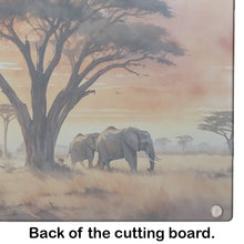 Load image into Gallery viewer, Elephants Savanna Sunrise Glass Cutting Boards – Durable, Decorative Kitchen Art