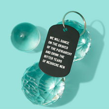 Load image into Gallery viewer, Dance on the Graves of the Patriarchy Dog Tag Keychain in Black, Laser Engraved