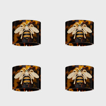 Load image into Gallery viewer, Stripey bee resin napkin rings, tortoiseshell, set of four
