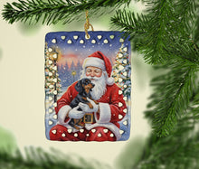 Load image into Gallery viewer, Black and Tan Dachshund with Santa Claus Porcelain Ornament