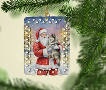 Load image into Gallery viewer, Keeshond with Santa Claus Porcelain Ornament